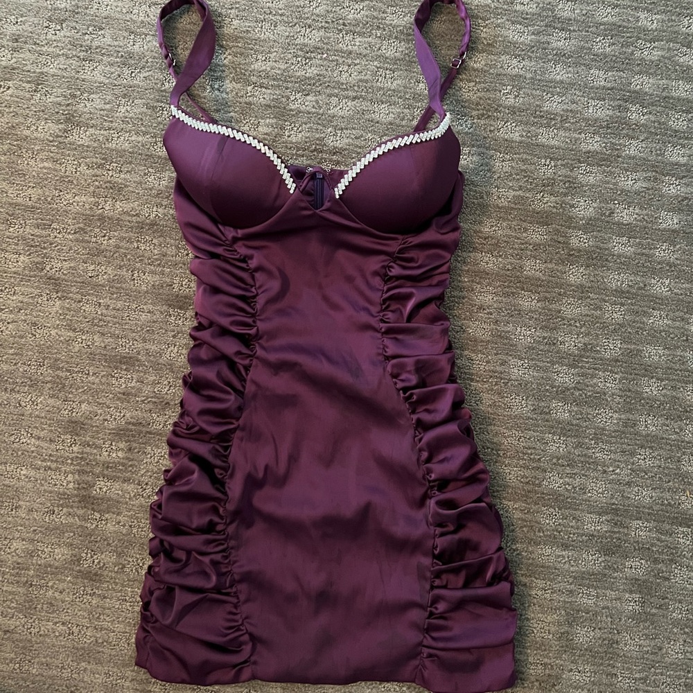 Formal corset style top, bodycon purple dress with rhinestone embellishments.